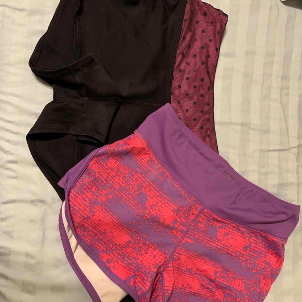 Two pair of running shorts.